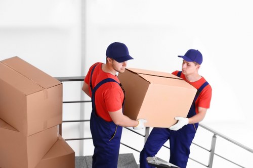 House removals planning in Wennington with packed moving boxes