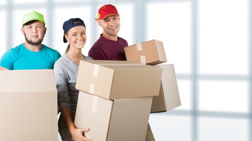 Local removals team handling a compact property move