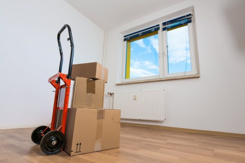 Packed boxes and household items prepared for flat removals in Wennington
